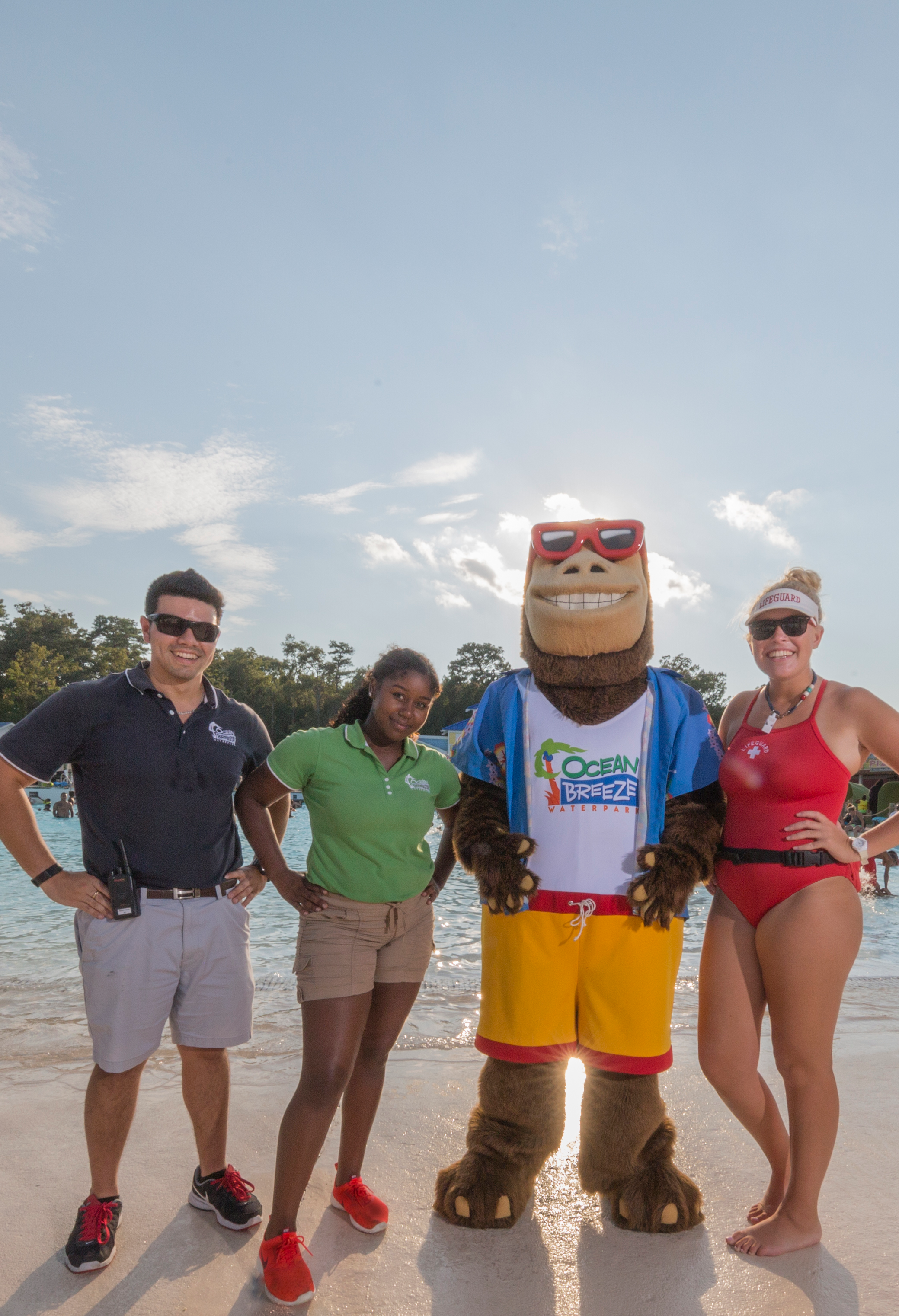 employees_and_hugh_with_tight_crop_no_masks_though_dont_use_for_now three employees with the ocean breeze mascot