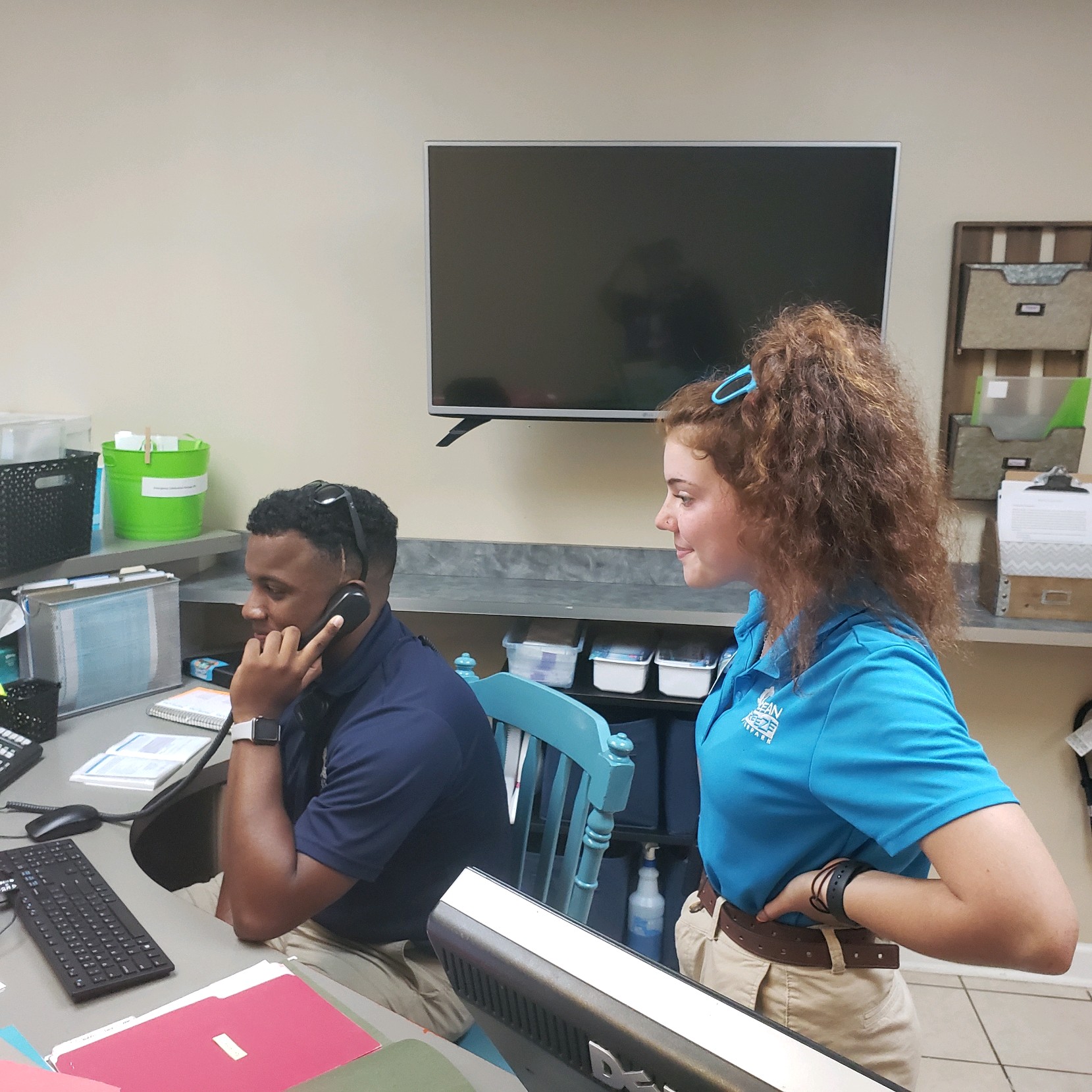 output_image16442632334141 Two ocean breeze employees at the office